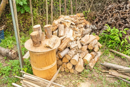 High angle view of a pile of firewood in the garden