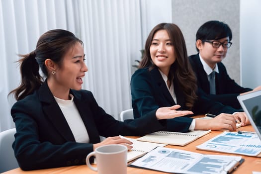 Business team of financial data analysis meeting with business intelligence, report paper and dashboard on laptop for marketing strategy. Business people working together to promote harmony in office.