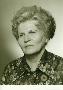 THE CZECHOSLOVAK SOCIALIST REPUBLIC - CIRCA 1980s: Retro photo shows studio portrait of an elderly woman. Vintage black and white photography.