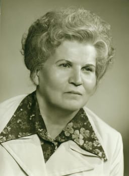 THE CZECHOSLOVAK SOCIALIST REPUBLIC - CIRCA 1980s: Retro photo shows studio portrait of an elderly woman. Vintage black and white photography.