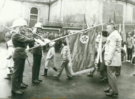 THE CZECHOSLOVAK SOCIALIST REPUBLIC - CIRCA 1980s: Retro photo shows firemen during country celebration. Vintage black and white photography.