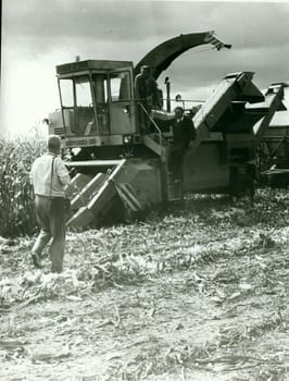 THE CZECHOSLOVAK SOCIALIST REPUBLIC - CIRCA 1980s: Retro photo shows combine harvester. Vintage black and white photography.