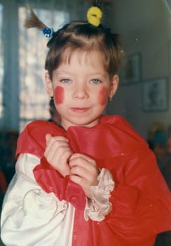 THE CZECHOSLOVAK SOCIALIST REPUBLIC - CIRCA 1980s: Retro photo shows small girl wears funny costum. Vintage color photography.