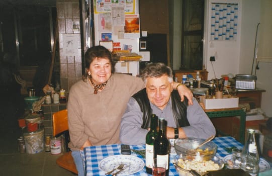 THE CZECHOSLOVAK SOCIALIST REPUBLIC - CIRCA 1980: Retro photo shows elderly couple during rural party. Vintage color photography.