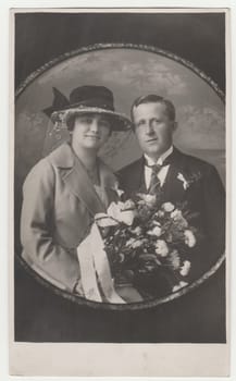 PRAGUE, THE CZECHOSLOVAK REPUBLIC - CIRCA 1940s: Vintage photo shows newlyweds. Photography is round shaped. Retro black and white photography.