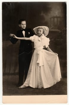 TABOR, THE CZECHOSLOVAK REPUBLIC - CIRCA 1940s: Vintage photo shows a dancing couple - children. A young couple takes dancing lessons. Retro black and white photography.