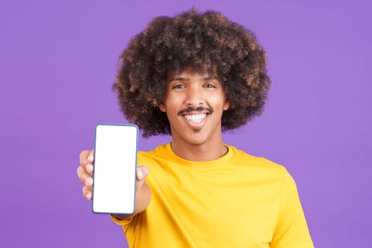 Blank screen of the mobile held by an african man with curly hair in studio