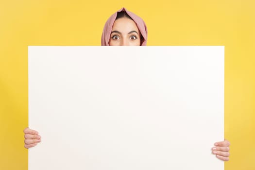 in studio with yellow background