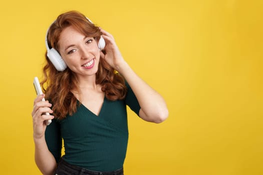 in studio with yellow background