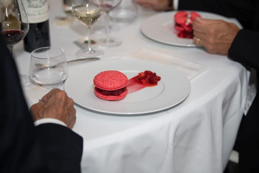 Pink macaroons on a plate at a wedding