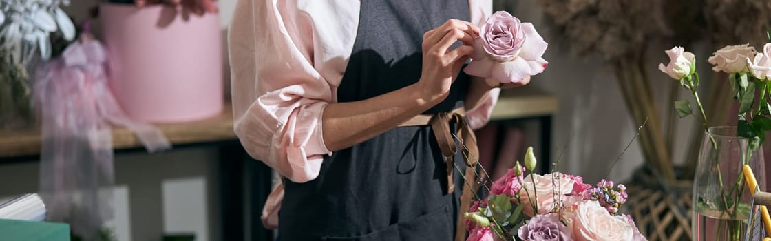 happy professional woman is working in flower shop