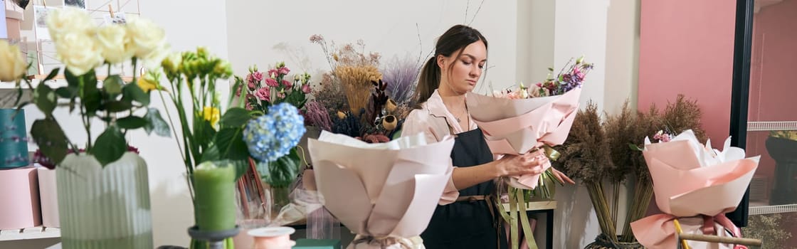 happy professional woman is working in flower shop