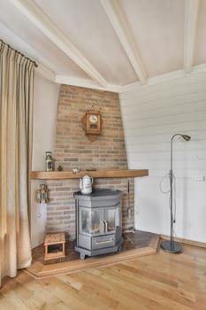 a living room with a wood burning stove in the corner and a clock on the wall mounted above the fireplace