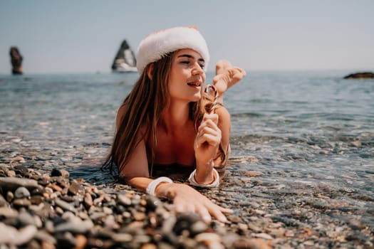 Woman travel sea. Happy tourist taking picture outdoors for memories. Woman traveler looks at the edge of the cliff on the sea bay of mountains, sharing travel adventure journey.