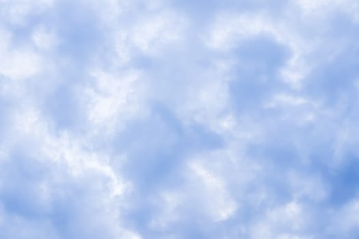 Background of blue sky with white clouds. Natural backdrop