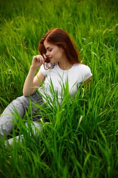 beautiful woman in casual clothes spends weekend in nature. High quality photo