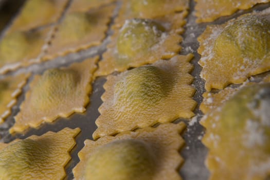 Recipe for Homemade Italian Ravioli pasta with Spinach and Ricotta Filling. High quality photo