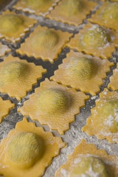 Recipe for Homemade Italian Ravioli pasta with Spinach and Ricotta Filling. High quality photo