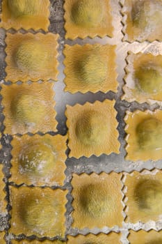 Recipe for Homemade Italian Ravioli pasta with Spinach and Ricotta Filling. High quality photo