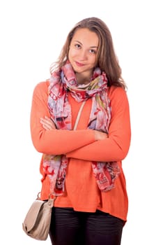 portrait of a pretty young girl in an orange sweater on a white background