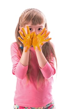 Children's painting. Little girl draws the sun.The girl painted the sun on her palms Arts and crafts for children. Paint on children's hands. Isolated on a white background