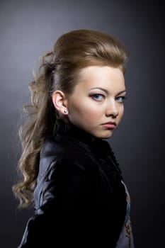 Image of pretty brunette posing in black jacket, close-up