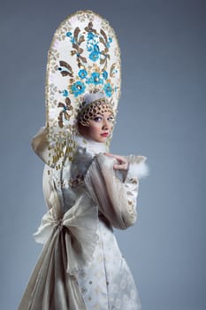 Portrait of young Russian woman in traditional costume