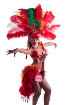 Pretty girl in carnival costume dancing in studio, isolated on white background