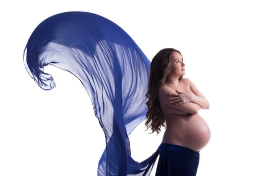 Image of pregnant woman posing with blue cloth, on white background