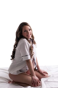 Smiling pregnant woman posing in studio, isolated on white