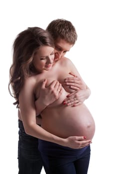 Topless man and pregnant woman posing in studio, isolated on white