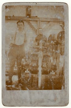 THE CZECHOSLOVAK REPUBLIC - CIRCA 1920s: Vintage photo shows workers in a factory. Retro black and white photography.