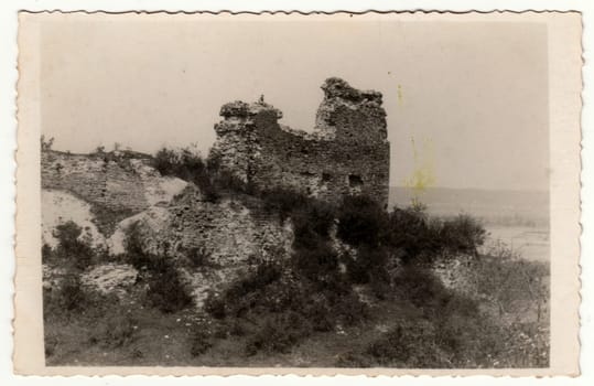 THE CZECHOSLOVAK REPUBLIC - CIRCA 1930s: Vintage photo shows ruins of castle. Original retro black and white photography taken from photo album. No postprocess