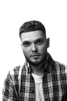 young man with stylish hair and beard looking at camera on white background