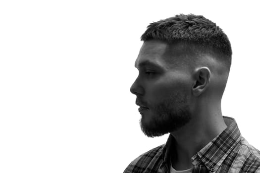 side view of man with stylish hair and beard on white background