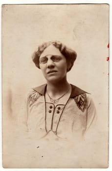 AUSTRIA-HUNGARY - CIRCA 1917: Vintage photo shows a mature woman wears vintage antique nose clip glasses. Retro black and white photography. Photo was taken in Austro-Hungarian Empire or also Austro-Hungarian Monarchy. Circa1920s.