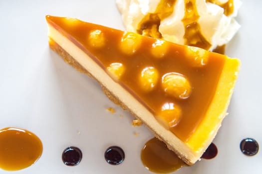 macadamia caramel cake on a plate cuisine dessert sweet food.
