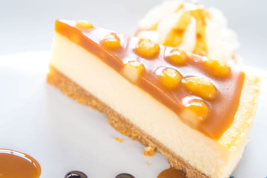 macadamia caramel cake on a plate cuisine dessert sweet food.