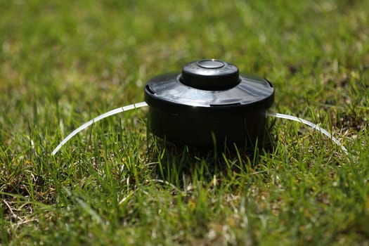 automatic sprinkler system watering the lawn on a background of green grass, close up.