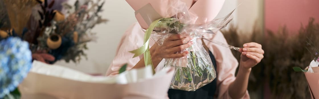 happy professional woman is working in flower shop