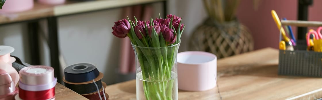 happy professional woman is working in flower shop