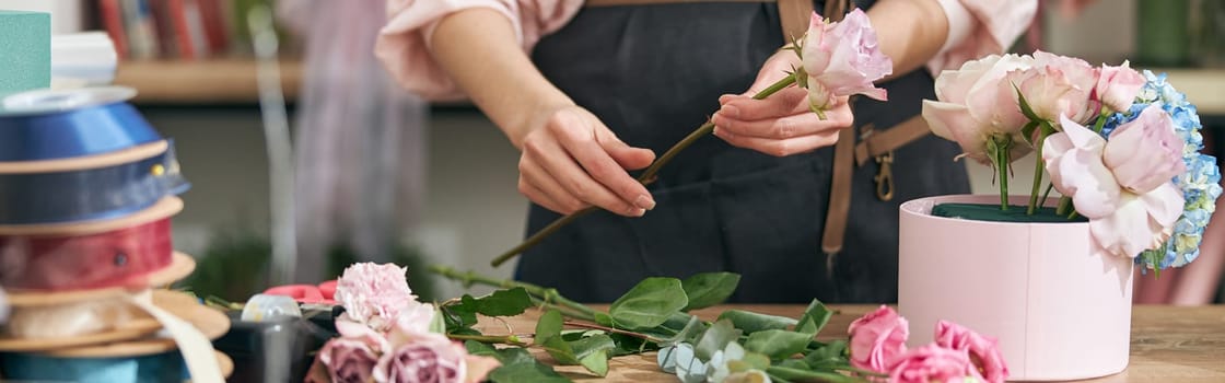 happy professional woman is working in flower shop