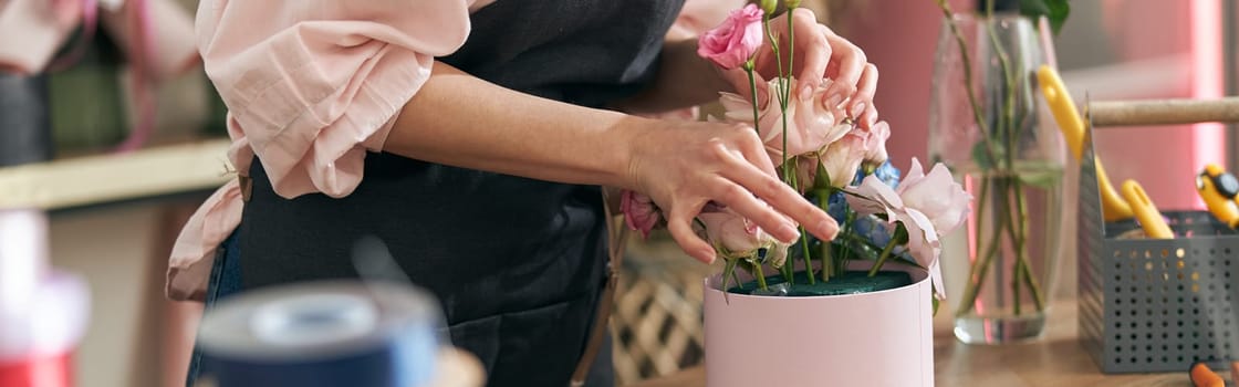 happy professional woman is working in flower shop