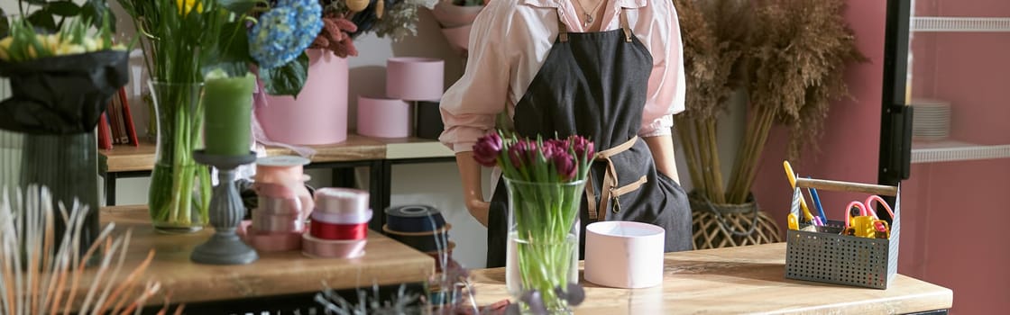 happy professional woman is working in flower shop