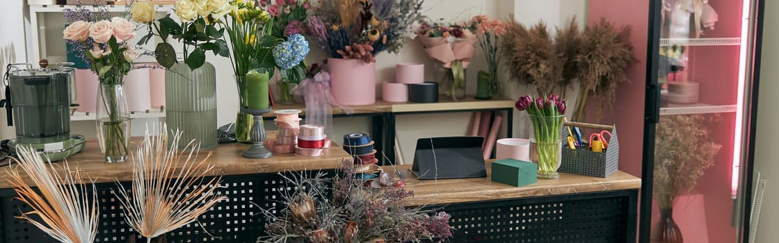 happy professional woman is working in flower shop