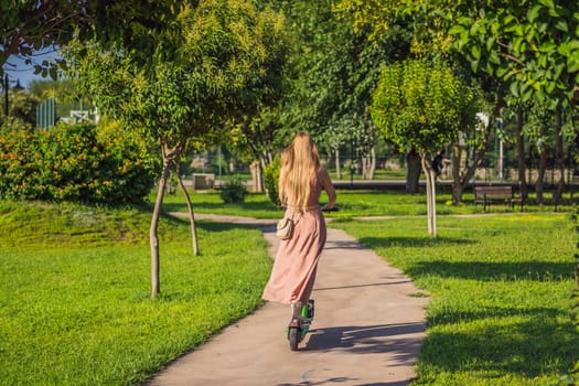 Young beautiful woman riding an electric scooter to work, modern girl, new generation, electric transport, ecology, ecological transport, sunset, electric skateboard.