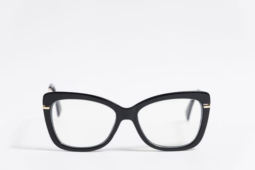 Black female eyeglasses isolated on white background close-up, fashionable trendy stylish accessory.