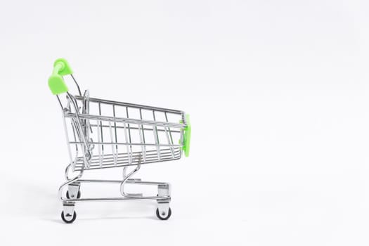 Shopping trolley cart isolated on white background, copy space.