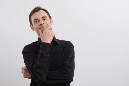 Caucasian man 30s in a black shirt portrait on white background.