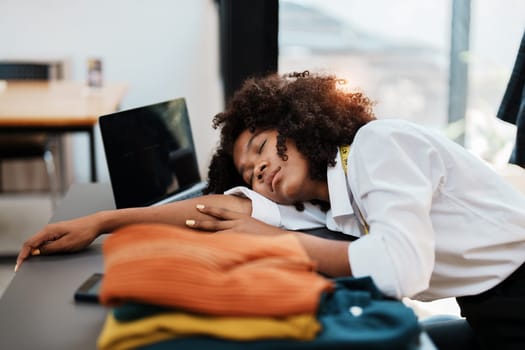 young teen african american fashion designer stylish burnout working at fashion Business studio.